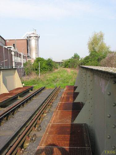 After passing the bridge the tracks run along a Sappi paper factory