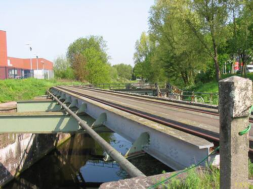 A bridge after a railway level crossing.